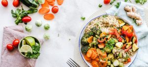 a variety of vegetables on a table and in a bowl