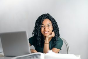 Woman researching ways for finding support after moving on a laptop