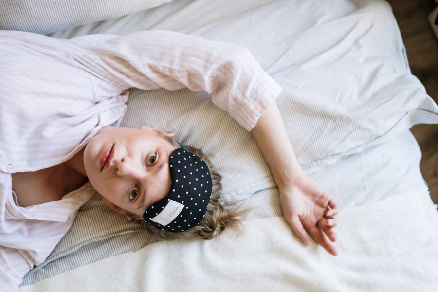 Woman lying awake in bed.