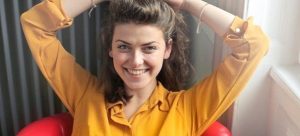 A happy, smiling woman.